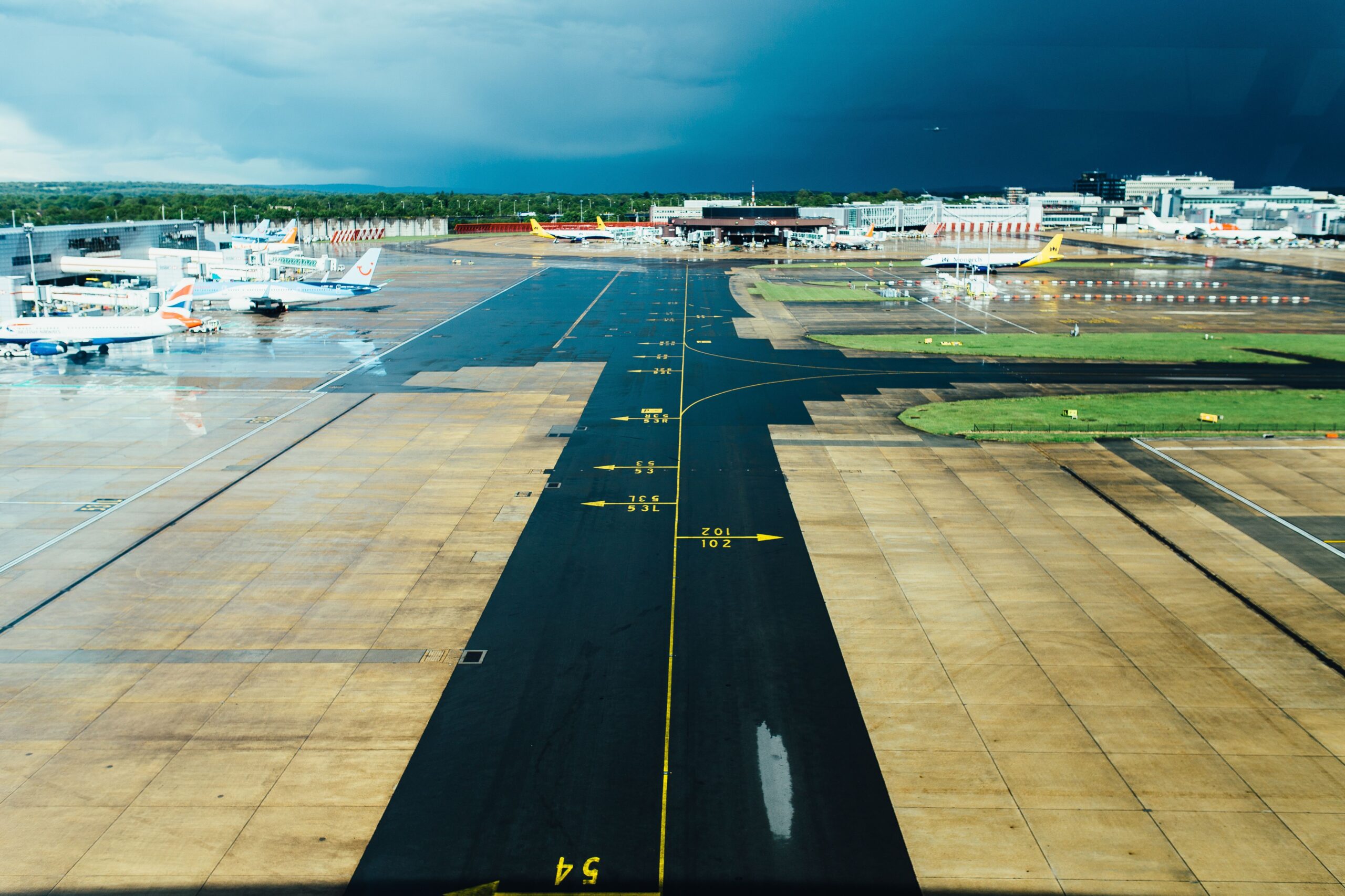 Professional airport taxi driver tracking flight arrivals for reliable Edinburgh airport pickup